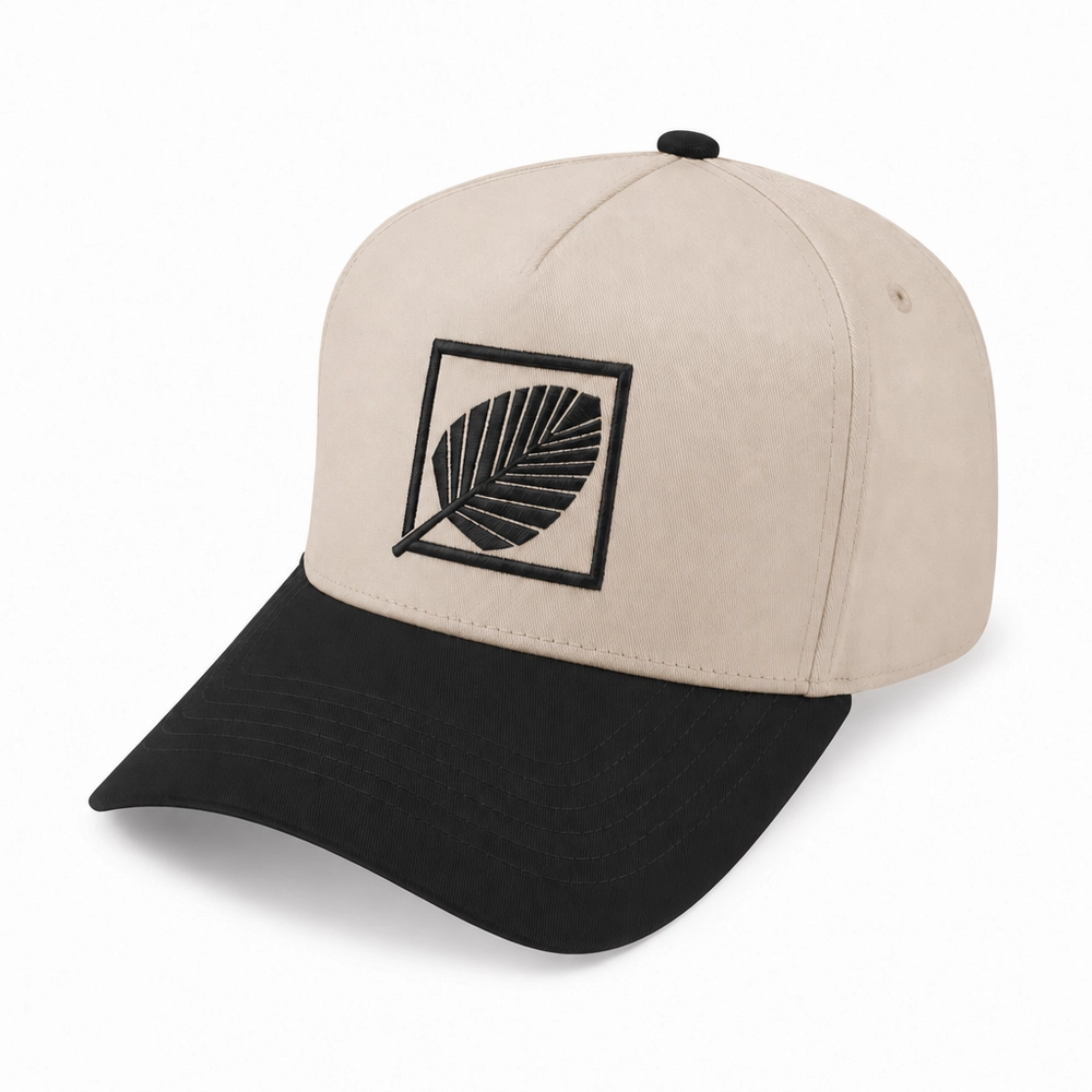 Signature Kingdom Logo Cap in black and tan with the leaf emblem